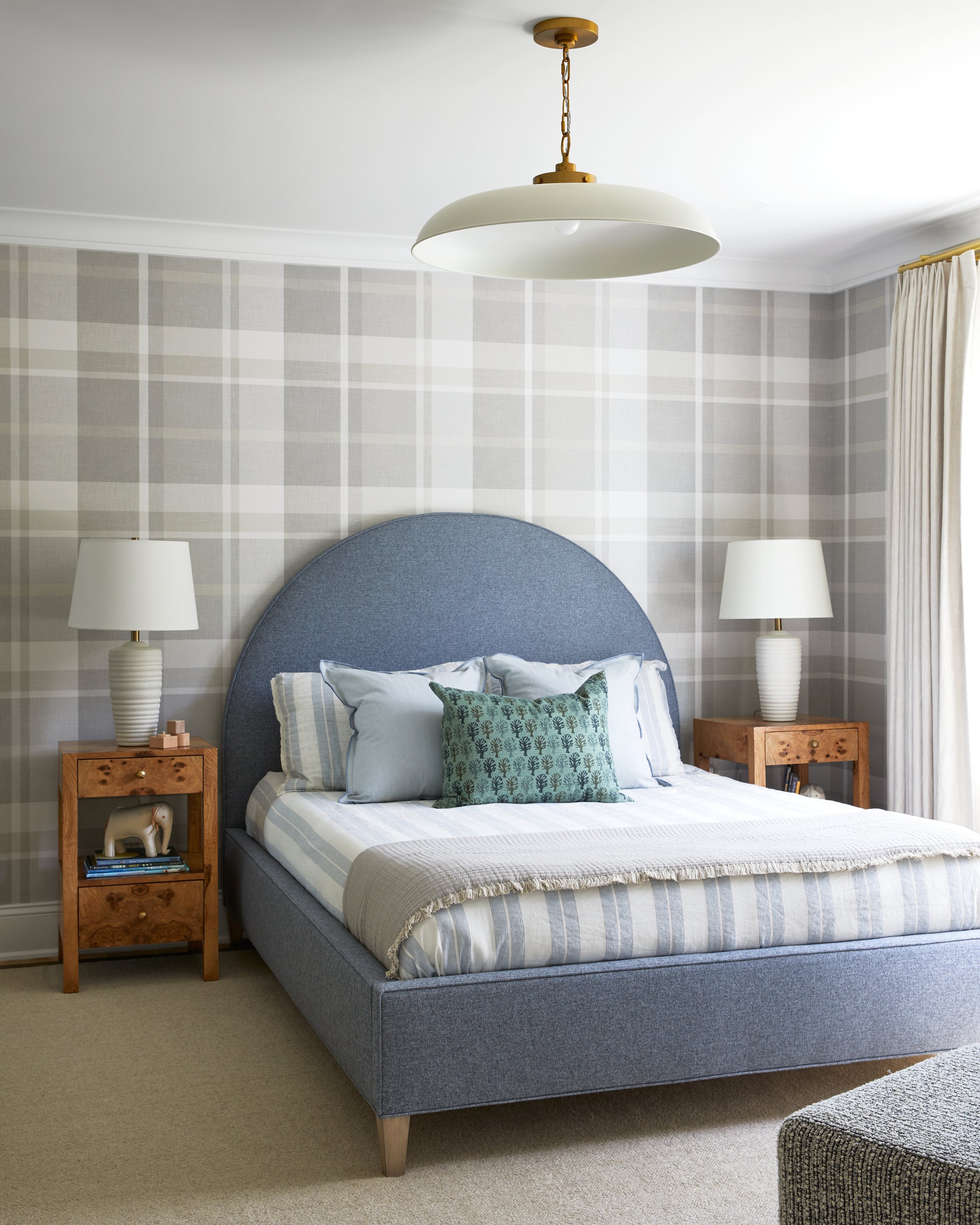 Boys' bedroom with blue and gray plaid wallpaper and an arched headboard in a Chatham, New Jersey home by Ellie Mroz Design.