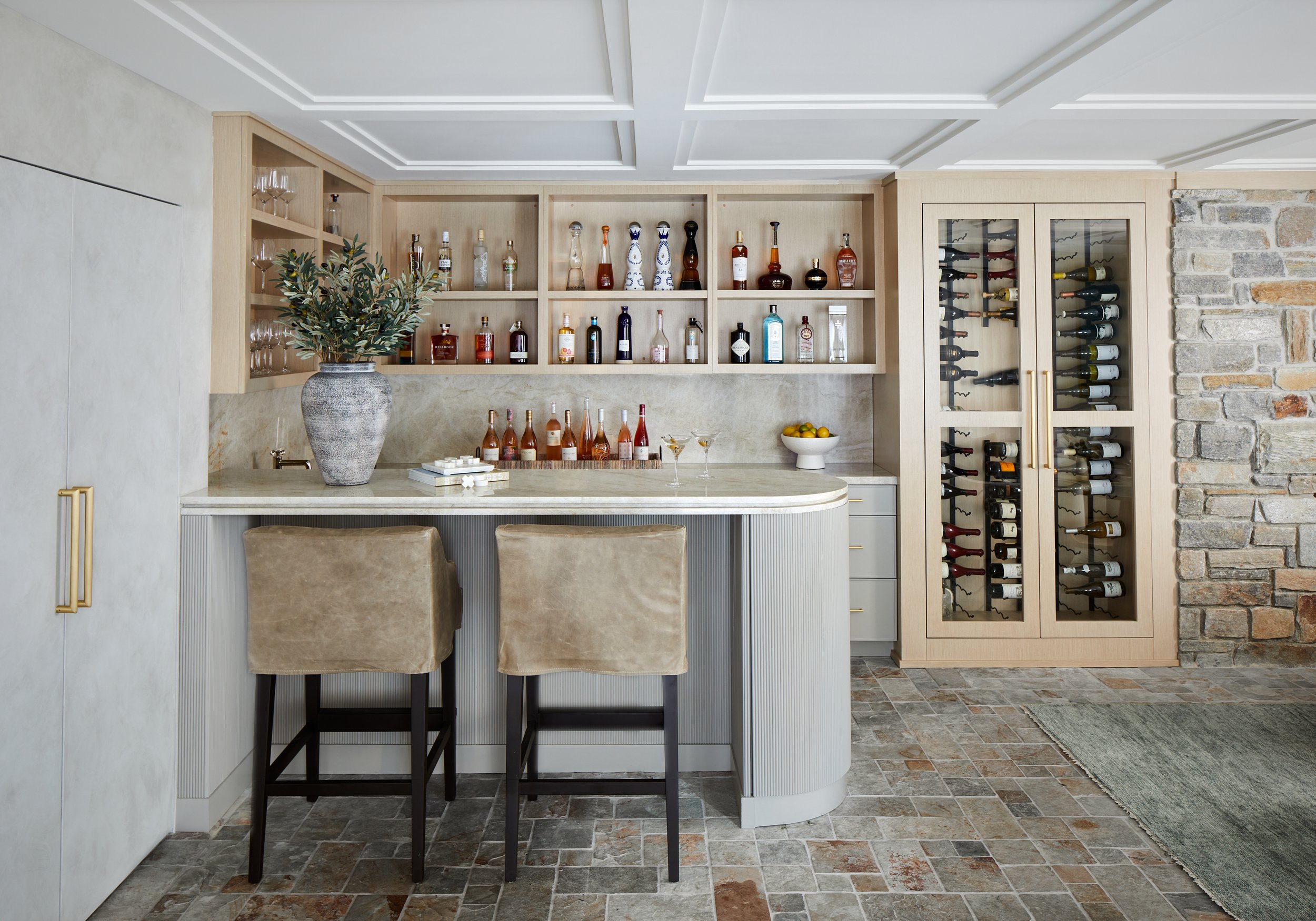 Wet bar with open shelving and wine storage in a Westfield, New Jersey family room renovation by Ellie Mroz Design.