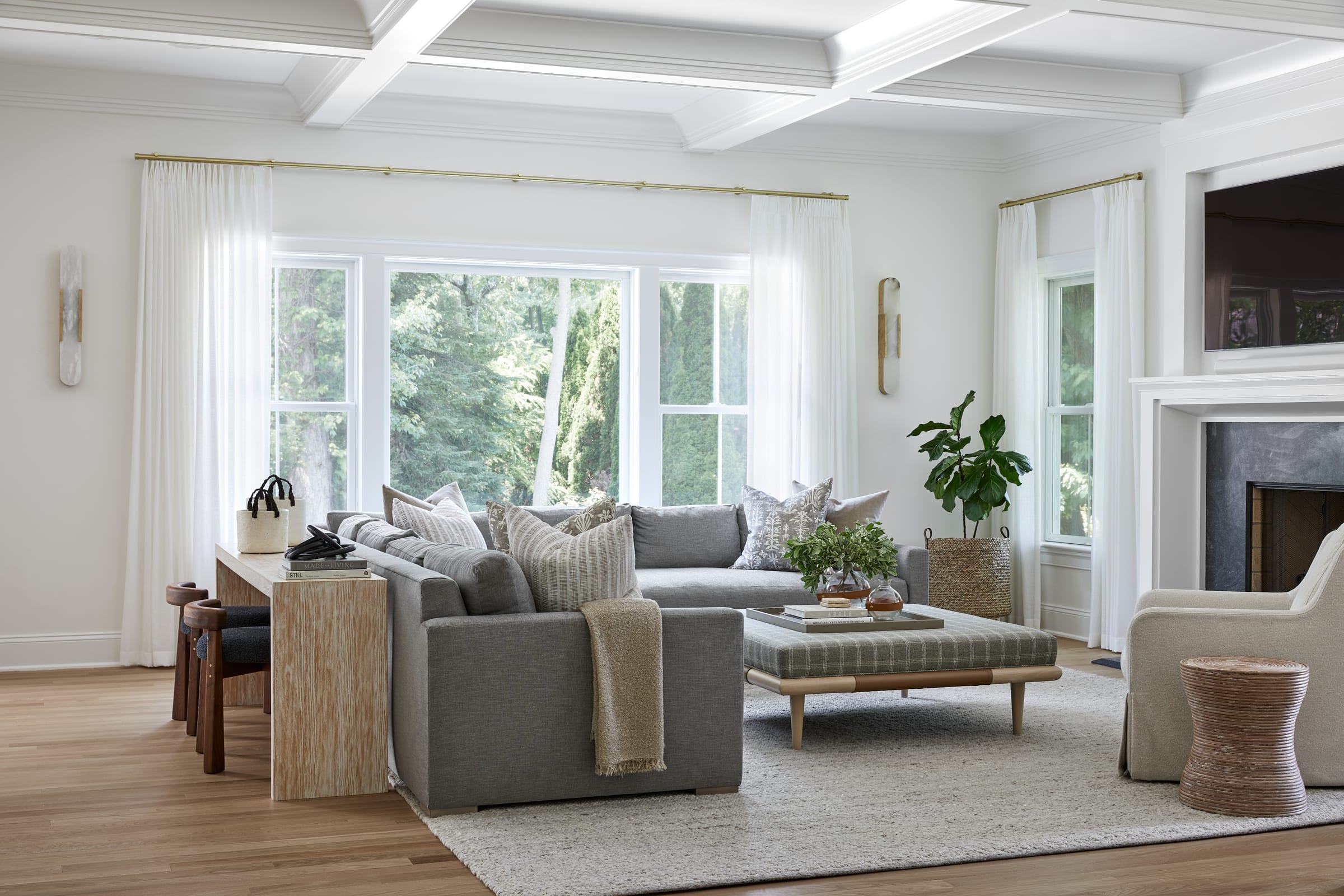 Fresh, airy family room with layered seating and natural light in a Chatham, NJ home by Ellie Mroz Design.