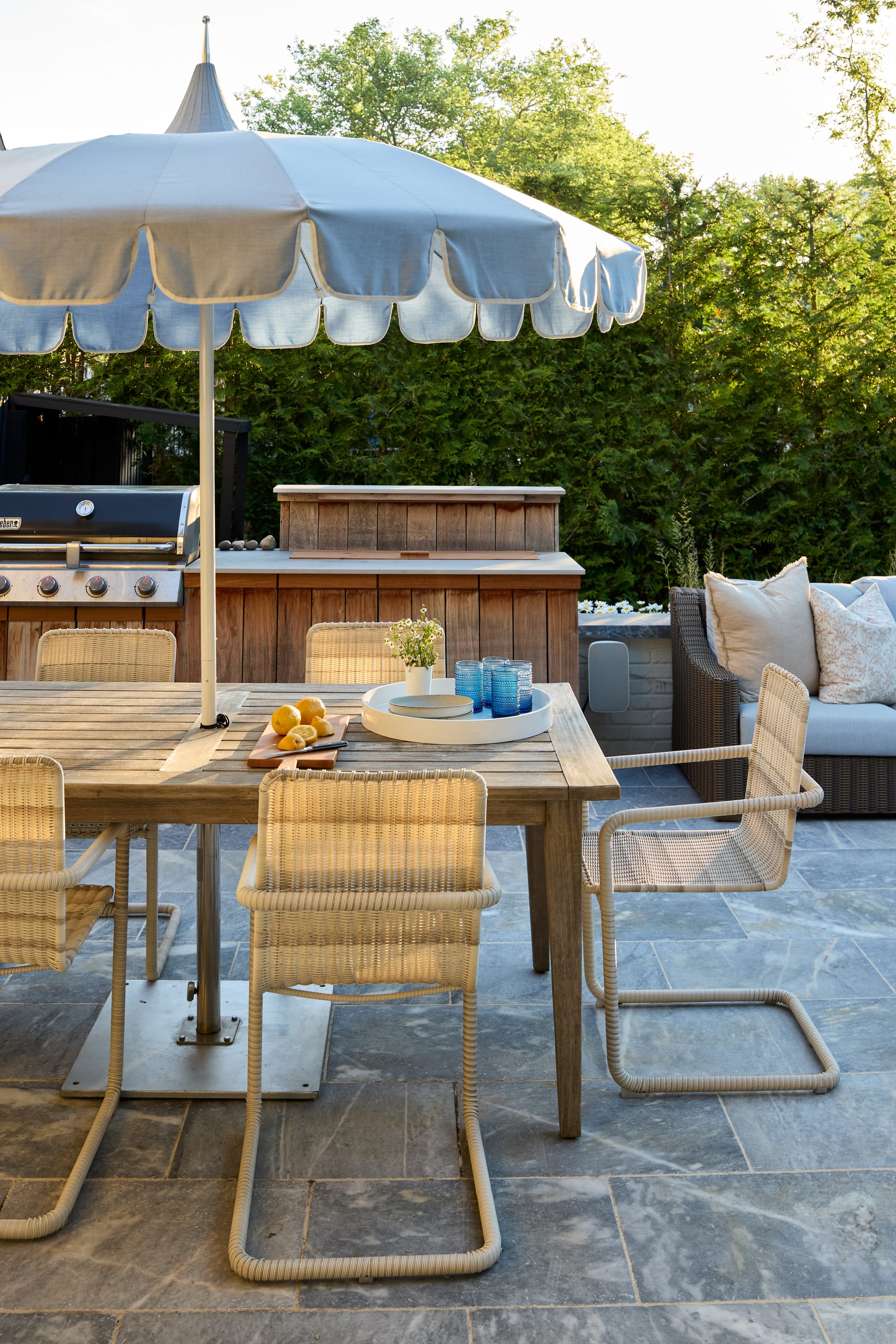 Outdoor kitchen and dining patio in a Westfield, NJ backyard.