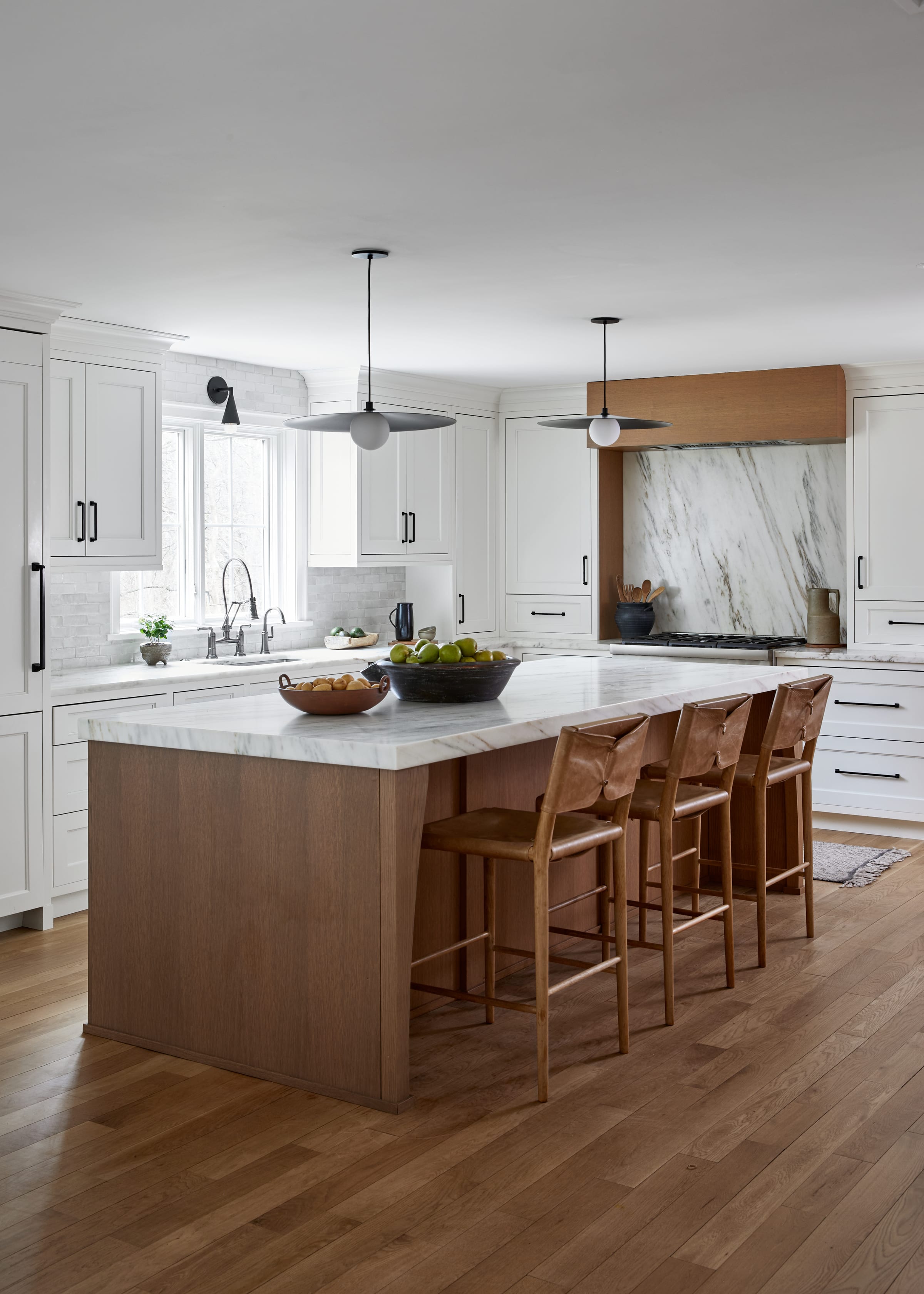 Oak, white and marble kitchen island in a Westfield, NJ home renovation.