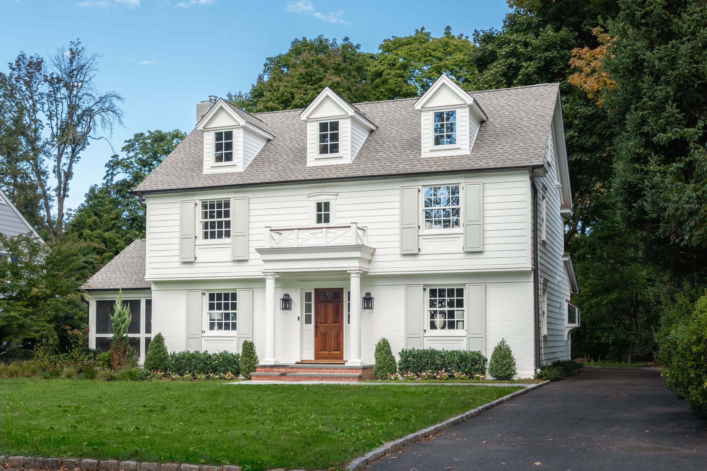Completed full exterior renovation of a storybook-style home in Summit, New Jersey by Ellie Mroz Design.