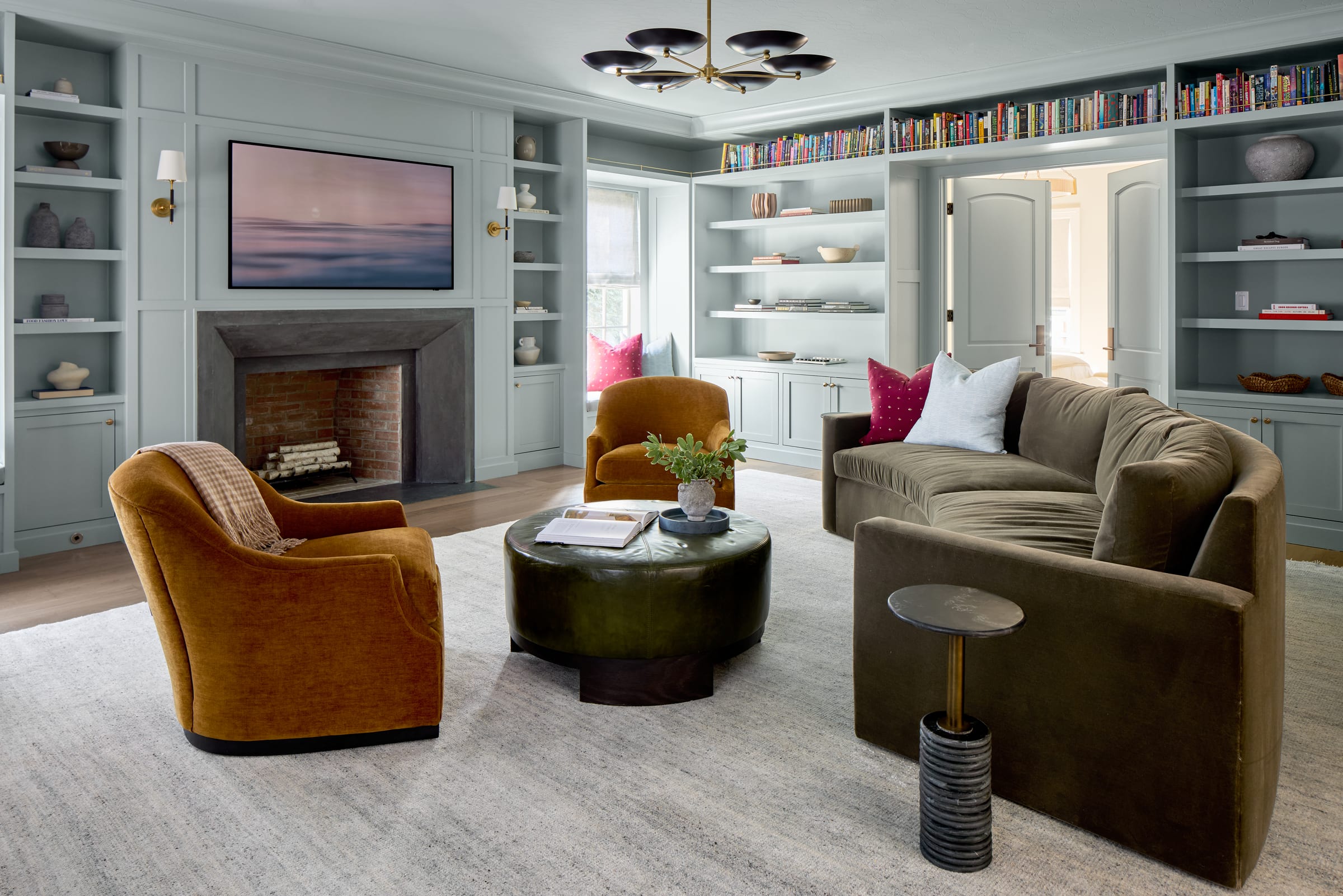Color-drenched family room and library in a Summit, NJ whole-home renovation by Ellie Mroz Design.
